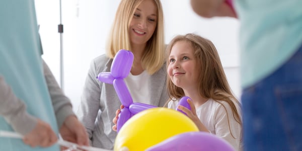 children playing with balloons