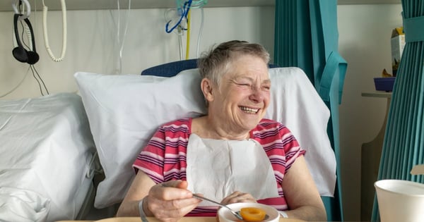 happy patient in hospital bed